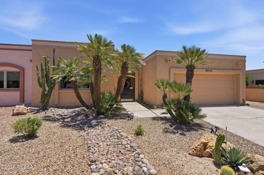 Nestled within the coveted Casas Del Oro Norte community at Tucson National, this beautifully remodeled single level townhome blends timeless Southwest elegance with modern comfort. Thoughtfully updated in 2021, the home welcomes you with rich travertine flooring, a spacious great room with a stylish fireplace and sweeping views that frame the golf course and surrounding mountains.

No thought was spared in the design of the gourmet kitchen. This chef inspired space features abundant drawer cabinetry that keeps everything within easy reach, stunning rich cabinetry, granite counters, stainless appliances, an induction cooktop and a wraparound island that offers exceptional prep space and the perfect setting for entertaining. It is truly a dream kitchen for anyone who loves to cook or host.

The open layout offers effortless flow with no interior steps and tasteful accessibility features that enhance everyday living. The primary suite provides a calming retreat with a walk in closet and a beautifully appointed bath. Outdoors, the private low care yard borders the natural wash and enjoys no rear neighbors, creating a peaceful setting with desert plantings, decorative gravel and uninterrupted views.

Located in a quiet gated 55 plus enclave known for its history, lush landscape and warm community feel, residents enjoy access to a heated pool, spa, walking paths and a charming bird sanctuary. With direct access to the LOOP, the Omni Resort, the YMCA and the nearby library, this home offers a rare blend of convenience, tranquility and refined desert living.