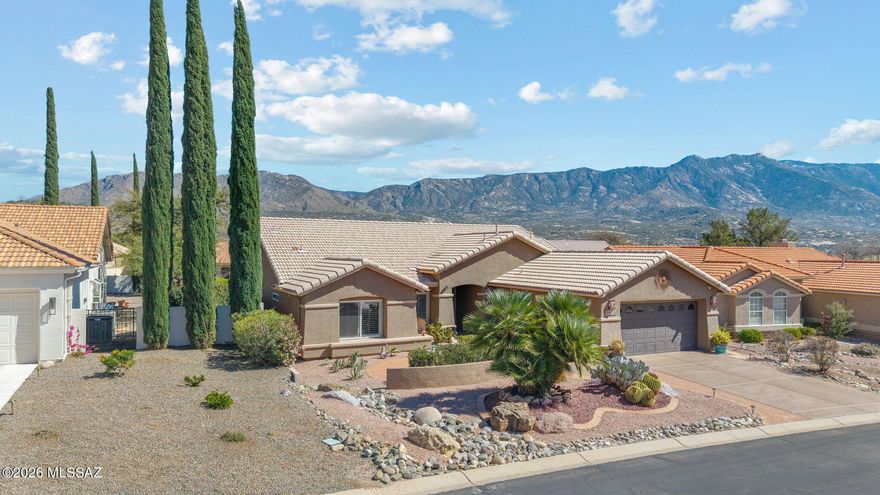 Welcome to this delightful Montana floor plan, thoughtfully re-designed with an open concept layout that is simply made for entertaining - the moment you step through the custom security door, you are greeted by cheerful southwest colors and beautiful terra cotta tile floors that set the tone for everything this home has to offer. Attention to detail is evident throughout, from the plantation shutters and kitchen island to the vaulted ceilings, split bedroom plan, and the extended master bay window and sliding door that bathe the primary suite in natural light. The kitchen dining area has been thoughtfully expanded, and the great room flows effortlessly to the covered patio and the gated private yard, where a brick and tiled patio await your morning coffee or evening unwind. Step out front and enjoy the charming courtyard, the perfect spot to take in another spectacular Arizona sunset as it casts a golden glow across the Catalina Mountains - a view that truly never gets old. Situated on a quiet cul-de-sac with east/west exposure, this 2-bedroom, 2-bathroom home also features a den, a dedicated laundry room, and a 2-car attached garage with RV parking. Tucked within SaddleBrooke One, residents enjoy easy access to a full clubhouse, swimming pools, spa, tennis, golf, putting green, and on-site dining in this premier 55+ age-restricted community. Please see Documents tab for items to convey/not convey at time of sale. This is a special opportunity to be substantially furnished, or not. Itemized list available in Documents tab.