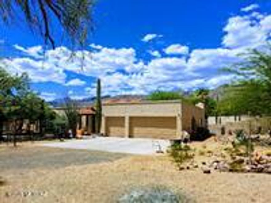 Rare 1-Acre Accessible Oasis & Horse Property in Northeast Tucson! Nestled in a quiet, family-centered community with NO HOA, this stunning 1-acre gated estate perfectly blends true desert beauty with complete, seamless accessibility. Completely remodeled down to the studs in 2021, this home boasts a thoughtful universal design engineered by a Wounded Warrior architect and an OT CAPS specialist, offering a fully ADA-compliant floor plan that remains warm, open, bright, and inviting.

Step inside to a wide-open interior framing breathtaking mountain views, mature mesquites, and majestic saguaros from every window. The dream kitchen is built for entertaining, featuring premium granite countertops, high-end knotty alder cabinetry, an induction stove, and double ovens. Every bedroom is generously sized with ceiling fans, highlighted by a spectacular primary walk-in closet. Practicality meets luxury with a massive multi-purpose laundry room designed to store everything from hiking gear to adaptive equipment, plus a large dedicated office featuring beautiful built-in shelving.                                                        
Accessibility & High-End Upgrades Include:

Roll-in / zero-entry shower with fixed and handheld showerheads.

Therapeutic jetted bubble tub.

Tankless instant water heater & new dual HVAC units (all updated in 2021).

Fresh interior and exterior Dunn Edwards paint.

An Outdoor Paradise:
The entire property is fully fenced--complete with a protective snake fence--and features a solar-powered main entrance gate alongside a convenient secondary loop driveway with a manual gate. Relax year-round under the massive covered back patio running the full length of the home, or enjoy the sparkling saltwater pool, equipped with a dedicated pool fence and a lift chair.

The expansive grounds offer private walking trails, a dog run, kids' playground structures with pull-up bars, and a sustainable "laundry-to-landscape" graywater system. Horse lovers will appreciate the dedicated horse shade covering structure (18 ft long X 13ft 8 inches wide by 8 ft 8 inches tall) and plenty of room to roam, complemented by a massive 3-car garage outfitted with pegboards and a workbench--perfect for storing hay, tools, and toys. Incredible location with direct access to Mt. Lemmon, local parks, and top-tier schools (TVUSD, Hermosa Montessori, Collier Elementary).

This property is a rare gem where luxury, sustainability, and absolute accessibility meet.
