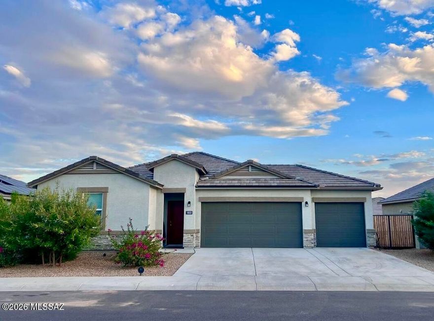 Built in 2022, this 4 bed, 2 bath home features a split floor plan with a spacious kitchen offering a large corner pantry, granite countertops, stainless steel appliances, and Espresso cabinets. The kitchen overlooks the great room, perfect for entertaining. Secondary bedrooms include walk-in closets. Interior finishes include 20'' tile in main areas, cultured marble bath vanities, and window blinds. Enjoy a 3-car garage, smart home package, garage door opener, and desert landscaping front and back.