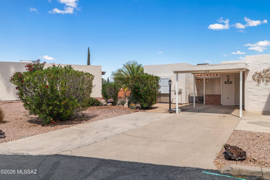 Whether you're seeking a full-time residence or the perfect seasonal retreat, this 2-bedroom, 2-bathroom townhome is sure to impress. The heart of the home features a nice kitchen complete with butcher block countertops and sleek appliances. You'll find easy-care tile and laminate flooring throughout, complemented by a fresh interior paint. The versatile Arizona room offers extra living space for relaxing or a hobby area, while two dedicated storage units provide plenty of room for gardening tools and gear. While the front carport is advertised for a single car, the concrete pad can accommodate up to three vehicles--perfect for your car, guest parking, and a golf cart! Privacy is a priority here: the guest wing functions as a true private suite. Come see all Green Valley has to offer!