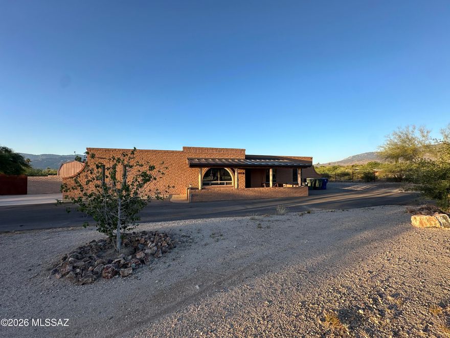Positioned on an elevated lot in highly sought-after Rancho Del Este, this one-of-a-kind 3 bedroom, 2 bathroom home showcases spectacular mountain views, a beautifully updated kitchen, new flooring throughout, and a recently replaced HVAC system. The fully fenced property features stunning custom ironwork, electric double gates, and an impressive RV garage/workshop complete with electrical, a swamp cooler, and car lift. The backyard is an entertainer's dream with an extended covered patio, sparkling pool, tranquil fountain, and plenty of space for all your toys, vehicles, and outdoor hobbies. Low electric bills with owned solar - to be paid off at close!