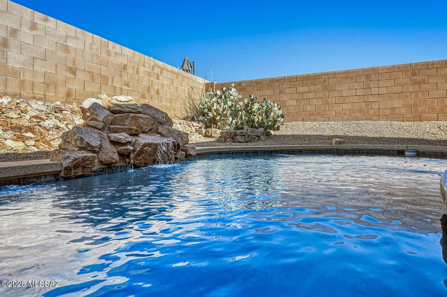 Live the Dream: Private Pool, 5 Beds & a 3-Car Garage! Step into this fantastic 5-bedroom, 3-bath home offering approximately 2,400 sq ft of bright, modern living with a highly desirable open-concept layout. Freshly refreshed with new interior and exterior paint and brand-new carpet, this home is move-in ready and designed to impress. The kitchen is the heart of the home, featuring granite countertops, plenty of  cabinetry, stainless steel appliances, and a breakfast bar that opens seamlessly to the dining and living areas--perfect for entertaining. The main level includes a full bedroom and bathroom, ideal for guests, multi-generational living, or a home office. Tile flooring throughout the main floor (except bedroom) enhances both style and functionality. All bathrooms have been tasteful remodeled with sleek tile walk-in showers, adding a modern touch throughout. Upstairs, you will find the owner's suite with a spa-like bathroom with Dual vanities, a modern freestanding soaking tub, a spacious tile shower, and a large walk-in closet. You'll also find three additional bedrooms, an updated guest bath, and a convenient upstairs laundry room with washer and dryer included. Additional highlights include: Ceiling fans throughout, Water softener and Desirable 3-car garage for extra storage or hobbies. Step outside to your private backyard oasis, where you can relax under the covered patio or enjoy the sparkling pool (solar-heated) -- perfect for Arizona living and entertaining year-round. Homes with this combination of space, upgrades, and a pool don't come up often, don't miss it!