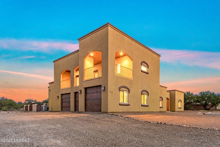 Range Priced $825K-$850K. NO HOA! VAIL SCHOOL DISTRICT! Experience elevated desert living in this exceptional 4-bedroom, 3.5-bath residence, thoughtfully designed with two primary suites—one on the main level for effortless convenience and another upstairs offering heightened privacy and access to its own panoramic mountain-view balcony. From sunrise silhouettes to sunset glow, the vistas are truly breathtaking. At the heart of the home, the chef's kitchen sets the standard for luxury, showcasing high-end Thermador appliances and a dedicated wine cooler. The outdoors features a spacious, fully enclosed backyard ideal for pets, gatherings, or future pool plans. Beyond the fenced area, the property extends across nearly 2.5 acres, providing rare flexibility to store RVs, trailers, and toys Design the RV garage, workshop, or guest casita of your dreams. The possibilities are as expansive as the views.

Elegantly appointed and uniquely versatile, this home blends modern luxury with the freedom and space that desert living is known foran extraordinary retreat ready to exceed every expectation.