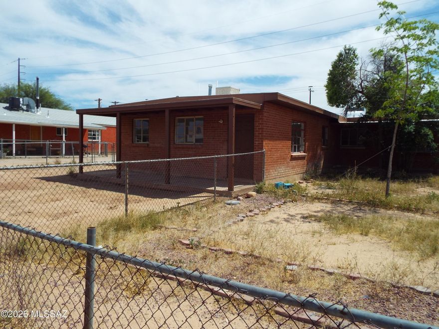 Many improvements, recently painted, excellent location near Swan.  Live in one side rent the other. Large fenced in yard for both units.  Plenty of natural light.  Tile throughout, Pictures wont do it justice.  Come see it you wont be disappointed.  One Unit has AC the other just had new mini splits installed.  The sq footage and expense figures are approximate figures.  There is a new water heater that was just  installed in one of the units.
