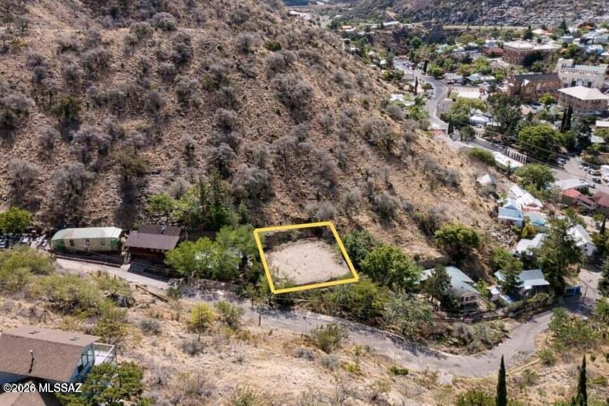 Rare opportunity to own a buildable residential lot in historic Bisbee. Located just off Tombstone Canyon Rd, 34 Art Ave offers paved access with water on-site and utilities at or near the lot line, reducing development costs. This 0.11-acre hillside parcel features city and mountain views in a quiet setting, just minutes from downtown shops, restaurants, and galleries. No HOA or deed restrictions (buyer to verify), making it ideal for a custom home, second home, or investment. Strong location with long-term upside in one of Southern Arizona's most unique markets.