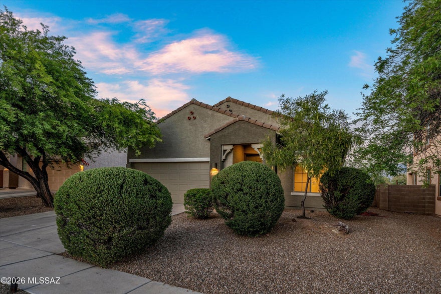 Spacious 3-bedroom, 2-bath home located in Oro Valley. This move-in ready property features high ceilings, tile flooring throughout, fresh interior and exterior paint, granite countertops, fireplace, stainless steel appliances and a new roof. Enjoy a bright and inviting layout perfect for entertaining with a partial view of the Catalina Mountains in the backyard, a gas fire pit and covered patio. Conveniently located near shopping, dining, parks and all that Oro Valley has to offer, this home combines comfort, style and scenic desert living.