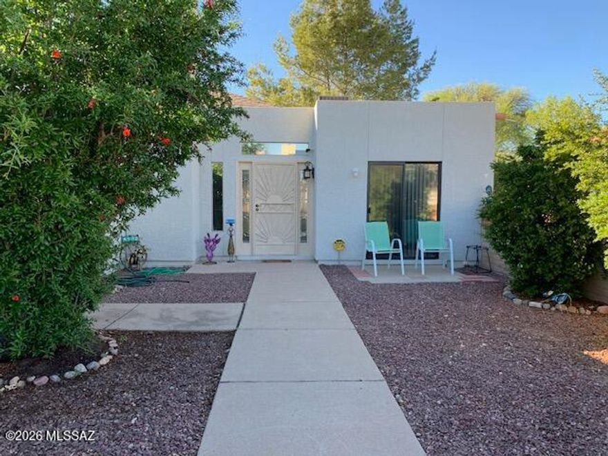 Discover this turnkey townhome in a lovely, gated community. The inviting great room, complete with a cozy fireplace, opens to a private patio featuring low-maintenance artificial turf and lush fruit trees, perfect for relaxing evenings. This home boasts a split-bedroom layout, a walk-in closet, an ensuite primary bathroom, and a convenient laundry room. Enjoy the benefits of a new roof, newer AC, and beautiful ceramic flooring. Conveniently located near schools, supermarkets, and restaurants, and just moments away from the scenic San Cayetano Mountains, this home is a must-see!