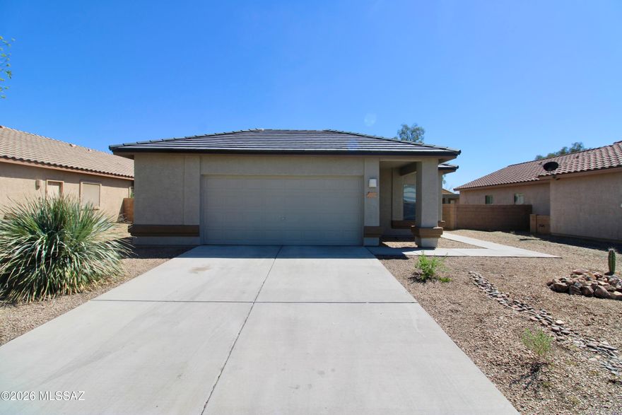 1,265 SQ FT! 3 bedroom, 2 bath home in Marana's Gladden Farms! Desirable single story floor plan with welcoming great room entry. Charming kitchen with new appliances, & ample cabinetry/countertop space! Neutral interior with fresh paint throughout + tile flooring in all the right places. This home offers 3 nicely sized bedrooms, each with ample closet space! Primary suite with full bath. Blinds + ceiling fans! Enjoy a low up keep backyard with covered patio. 2 car garage! Gladden Farms is a well maintained community with biking/walking trails throughout.