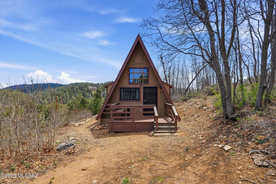 Quiet cozy cabin in the woods. 1-bed 1-bath with an upstairs loft. Front deck with built in seating with storage. Kitchen includes refrigerator, flat stove top and microwave. Open living space with electric fireplace, baseboard heating to keep you warm in the winter and built in shutter exhaust fan to keep you cool in the summer months. Loft bedroom upstairs, back room can serve as an extra bedroom with a 3/4 bath with an incinerator toilet. Nice back deck with great views to enjoy watching the wildlife. Close to walking trails. Located on Forest Service Leased land.