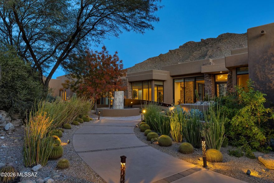 New kitchen counters & backsplash.Spectacular Soloway Designed Custom Residence in guard gated Canyon Pass at Dove Mountain. Resort and family style living at its best! Picture living in a part art gallery, part spa, part nature retreat and part resort hotel (staff not included!). This mesmerizing residence boasts an artistically stunning water feature art piece as you arrive at the front courtyard.  Enter through the custom created artistic front door into an open living area filled with wall to wall windows and glass doors. Interior views are stunning-and once you're out back the views turn to majestic. Photos can't capture the extraordinary oasis style living of this sprawling lifestyle. Fine craftsmanship throughout this luxury custom home. Each bedroom has its own private bathroom. Beautiful Dove Mountain is a 2025 Readers' Choice contender for Best Master-Planned Community. Enjoy Dove Mountain's world class golfing, outstanding hiking trails, biking paths, state of the art sports club, casual and fine dining options. Easy access to theatre and the arts, University of Arizona campus and multiple airports. Sonoran Desert living at Dove Mountain means enjoying outdoor living at its best. That lovely "cooing" sound you hear in the evenings may be the gentle Inca Doves which live in the area and give this elegant enclave its name. Pima County's 3,000-acre Tortolita Mountain Park borders Dove Mountain to the north. To the south is the 2,400-acre Tortolita Preserve, with its outstanding biking and hiking trails, designated to be permanently sustained by the City of Marana and the State of Arizona. Nestled in the beautiful Tortolita Mountain Foothills, Dove Mountain is perhaps the epitome of Southwest desert living. The temperate climate allows residents to enjoy an indoor/outdoor lifestyle virtually all year-round, not just in in the fall, winter and spring seasons for which the region is famous. The wildlife of Dove Mountain is fascinating. The Sonoran Desert is home to species like the Great Horned Owl, the Golden Eagle, the Black-chinned Hummingbird, Gambel's Quail, the Hooded Oriole and the Cactus Wren, Arizona's official bird. The lifestyle here is fascinating, mesmerizing, graceful, luxurious, peaceful and fun. Perhaps your own Dove Mountain story is just beginning at THIS lovely, fine custom home. Call for a private showing.