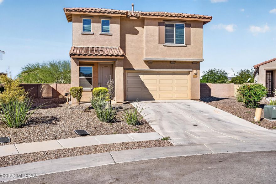 Incredible VA loan assumption @ 2.25% for qualified VA buyers!! Within the Vail School Dist, this beautiful home offers 2,070 sq ft of energy-efficient living. Featuring 3 bed/3 baths w/solar, no carpeting downstairs & fresh interior paint! The chef's kitchen boasts granite island w/breakfast bar & pendant lighting, dark espresso cabinets, gas range & walk-in pantry. Upstairs you'll find: an impressive owner's suite w/walk-in closet & luxurious bath w/dual vanity & walk-in shower; BRAND-NEW carpet in all bedrooms & the spacious loft; huge upstairs laundry w/tons of storage! Outside, enjoy an expansive low-maintenance backyard w/covered patio, extended pavers, artificial turf & no immediate rear neighbors. Community amenities: 2 pools, splashpad, pickleball & parks. Turnkey & move-in ready!