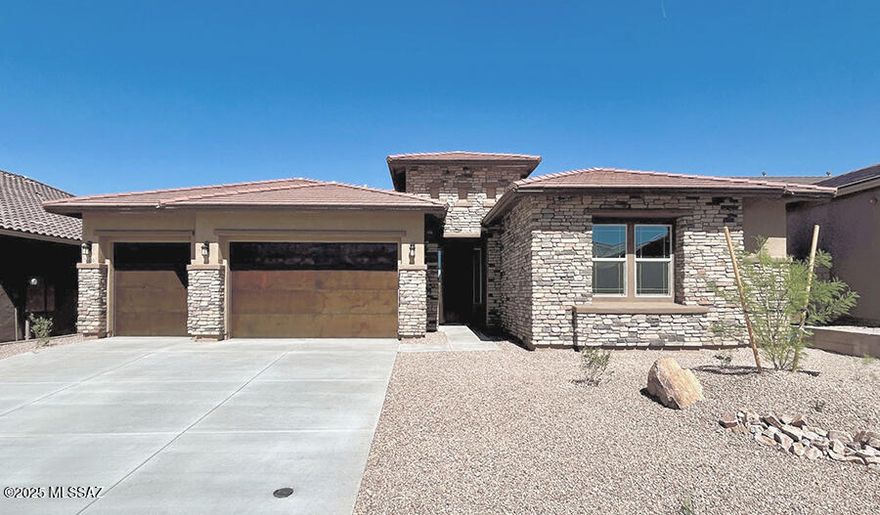 The ranch-style Holbrook plan offers a formal dining room connected to the gourmet kitchen via a butler's pantry. A large quartz kitchen island overlooks the nook and great room, with views of the covered patio. The primary suite includes two walk-in closets and a private bath. A fourth bedroom with an adjacent full bath and two bedrooms with a Jack-and-Jill bath are included. Scheduled for completion in April 2025!