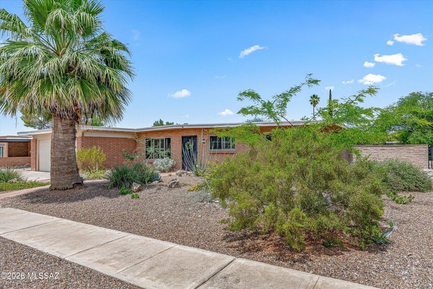 If you're wondering what the definition of turnkey is... this is it. Located in Tucson, this beautifully maintained home offers an open flow throughout with comfortable space in every room. Wondering if the bedrooms are big enough? Wonder no more. Natural light pours through the home, creating a bright and welcoming feel from the moment you walk in. New carpet throughout gives the home a fresh, inviting feel. Enjoy expansive mountain views from the backyard while thoughtfully planted trees and bushes continue to grow into a beautiful landscape that will provide added shade and privacy over time. Pride in ownership is evident throughout, with a well maintained interior and exterior that make this home truly move in ready and easy to love from day one.