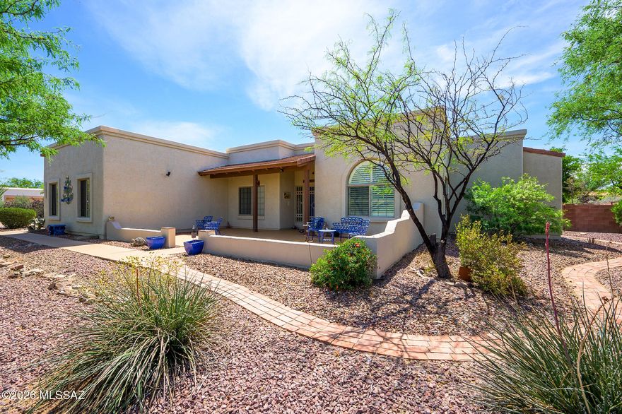 Immaculate home on nearly an acre in the desirable Antler Crest neighborhood! Enjoy peaceful desert living with plenty of space, privacy and room to grow. This well-maintained home is move-in ready, featuring a comfortable split floor-plan, 2-car garage with workshop, and Murphy bed in guest room.  The spacious backyard offers quiet areas to relax or entertain, featuring a waterfall, 14x14 storeroom and plenty of space for a pool or custom outdoor retreat. Home has been exceptionally well-cared for, with newer HVAC & water heater (2022), and 50 year epoxy/silicone roof coating. Located in the award-winning Vail School District and close to shopping & dining, w/easy access to DMAFB, Raytheon, and downtown Tucson, this home truly has it all!