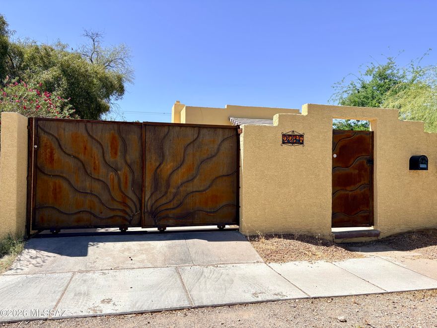 You don't want to miss this adorable, adobe and brick gated entry Tucson home! Located just three blocks from the University of Arizona, and very close to a bus stop for ease of transportation! Not to mention close by Banner University Medical Center, Flora's Market, Tumerico, Borderlands Brewing and within a few minutes drive to some of Tucson's best restaurants! You will have privacy in the historic and highly desirable Sam Hughes neighborhood. The home includes spacious living area, dining room and galley kitchen! All bedrooms are spacious and the back room has access to the back patio. Plus 3rd bedroom includes private bathroom and private access. Back yard has a very spacious patio with outdoor couch included. Shared yard with back tenant is gorgeously landscaped, too! Covered 1 car carport. Washer and dryer included! Pet Friendly. W/S/T included with flat rate. Property managed by owner.