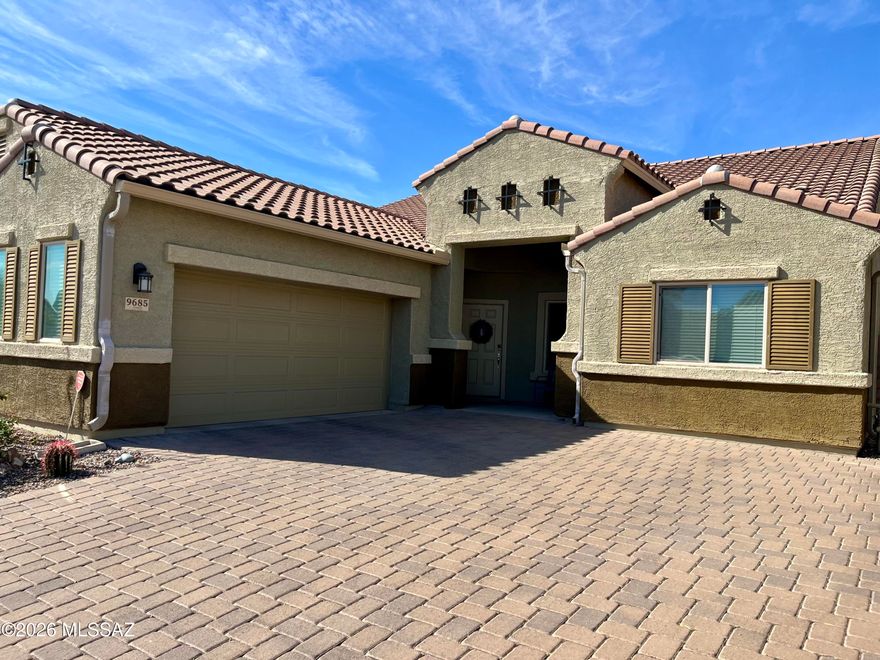 Say goodbye to builder-grade basics and say hello to high-end, custom design elements in this beautifully maintained home in Saguaro Bloom. From the moment you step inside, you'll notice the difference; coffered ceilings welcome you at the entry and set the tone for a home that truly shows like a model home. You will love the soaring 11' ceilings throughout. Just off the front door, the versatile den provides an amazing bonus space. The laundry room is both functional and thoughtfully designed with built-in cabinetry and an additional freezer that conveys with the home. At the heart of the home the kitchen is designed for both everyday living and entertaining. You'll love the granite countertops, oversized island with storage on both sides, walk-in pantry, stainless steel appliances, and a stunning backsplash that ties the space together beautifully. The peaceful primary retreat offers a quiet place to unwind and features its own private door leading directly to the backyard oasis.
 Step outside to a truly stunning outdoor space with no rear neighbors, breathtaking mountain views, turf, pavers, backyard lighting, a cozy fire pit, and a hot tub. This is truly the perfect setup for enjoying Arizona evenings. Back inside two additional bedrooms are thoughtfully positioned around a spacious teen retreat. This bonus area is incredibly versatile and could easily become another TV room, craft space, playroom, or additional office; the possibilities are endless. Living in Saguaro Bloom means access to an array of community amenities including parks, pools, a basketball court, walking and biking trails, and so much more. There's a reason so many individuals are making the move to Saguaro Bloom- come and see for yourself!