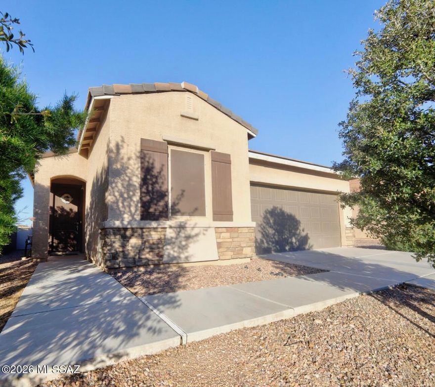 MOTIVATED SELLER! FHA ASSUMABLE @ 2.95% interest rate, Meritage builLOW LOW Power bills-currently $130month, See TEP usage report. NEW LENNOX Heat Pump (installed June 2024, $25K VALUE) w/10 Yr transferrable warranty!  Popular Picasso floor plan. 1879sqft, 4 bedrooms, 2 baths, with open-concept layout connecting living, dining & kitchen areas! Kitchen has newer refridgerator, granite countertops, large island, lots of cabinets and a large pantry. Large master suite with large master bath  walk-in closet. Secondary bedrooms with popular Jack & Jill bathroom.  WIC in two add'l rooms, large laundry room incl. washer/dryer. Solar screens included. Community POOL, SplashPad and Park  easy walk  just across the street. Easy freeway access-THE LOOP BIKE trail is accessible from the community.