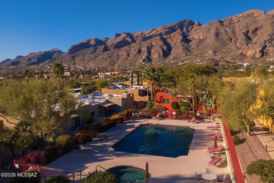 Welcome to the best location in the complex! This premium unit in Reflections in the Catalinas, offers unparalleled views of the Catalina Mountains from every room. This furnished 2-bedroom, move-in-ready condo features ceramic tile flooring throughout, walk-in closets in both bedrooms, and a kitchen that opens into the dining area and great room, complete with a cozy fireplace. This is a one story unit with no upstairs neighbors! The private front courtyard overlooks natural open space, with easy access to a convenient parking lot with plenty of guest spaces for visitors. Residents enjoy numerous amenities, including a clubhouse with a fitness center, a sparkling pool and spa, a grill station, and an EV charging station. HOA fees cover water, garbage, exterior painting, and roof maintenance. Nestled in the lovely Catalina Foothills, this home is just minutes from upscale shopping and dining at La Encantada. Fully furnished and nicely maintained, it's an ideal choice for a primary residence, winter retreat, or rental property.