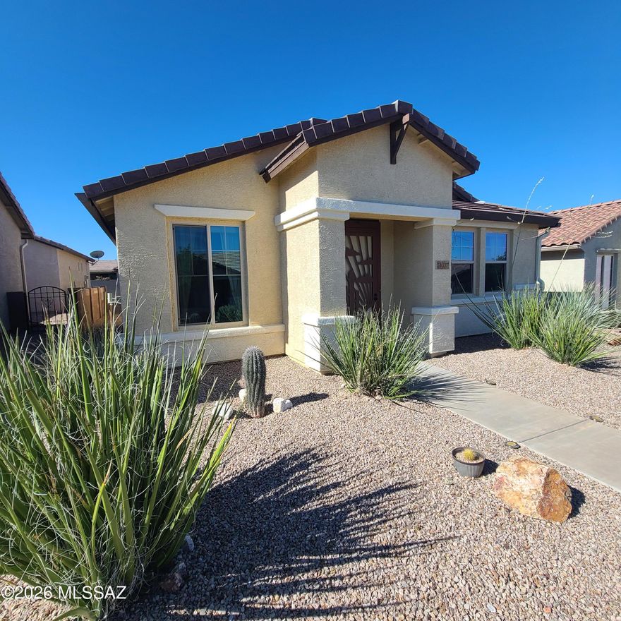 Impeccably maintained 2 bedroom, 2 bath home in Del Webb's popular Rancho Del Lago 55+ Active Community.  Floor plan features an open layout, spacious kitchen with large island & breakfast bar, & expansive windows welcoming natural light.  The private side courtyard offers a serene space for relaxing or entertaining.  Primary suite boasts a walk-in shower with bench, grab bar & oversized walk in closet.  High ceilings, recessed lighting & 2 car garage plus ample guest parking.  Close to Clubhouse with pool, spa , tennis, fitness, putting green, pickleball & more.