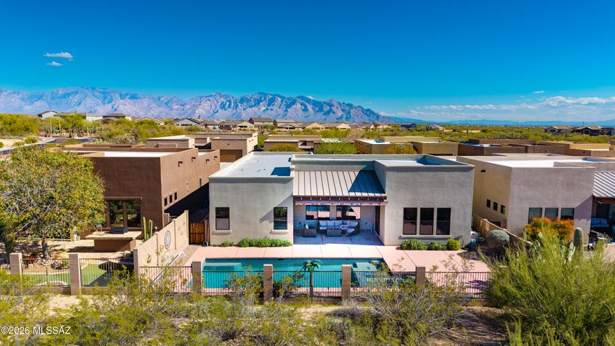 This move-in ready Miramonte Homes residence offers 2,404 sf of thoughtfully designed living space with a combination of comfort, style, and functionality. Enter through a gated courtyard and step inside to soaring ceilings and large windows filling the interior with natural light. The kitchen has granite counters, large island and walk-in pantry. The home features 3BD / 2.5BA / versatile Den and 3-Car Garage. The welcoming great room is perfect for relaxation or entertainment. Outside, enjoy the heated pool/spa, and covered patio with Sonoran Desert and spectacular Arizona sunset views. The primary suite offers patio access, and the bath features dual sinks, soaking tub, roll-in shower, and walk-in closet. Updates include new HVAC system, newer water heater, washer/dryer and refrigerator.
