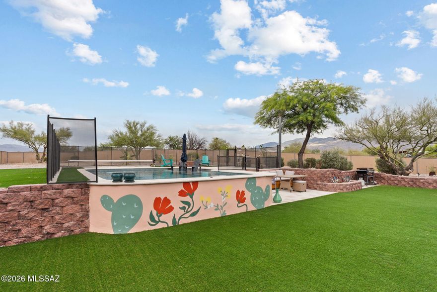 Welcome to this beautifully updated Eastside Tucson retreat on a generous 0.91-acre lot situated at the end of a cul de sac with breathtaking mountain views! This 3-bed, 2-bath home features a bright living room and separate family room/Den. Enjoy brand new carpet, quartz countertops, and a new roof (2026). The private backyard is an entertainer's paradise or perfect for a family to enjoy, with a saltwater pool (2021), covered patio, nearly 3,000 sq ft turf area, and outdoor kitchen hook-ups of power, water and dry well drain. RV 30amp electrical hook-up included. Owned 9.9kw solar system (2019), new HVAC (2024), water heater (2024), full home filtration system and water softener (2021) keep costs low year-round. This move-in ready gem is the total package!
