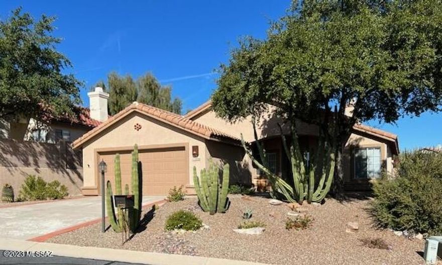 TUCSON NATIONAL HOME, Gated Community, Unfurnished, Elevated Lot backing Golf Tee with Nice Mountain Views!  Two Bedroom PLUS DEN, Two Bath. Enjoy the  Hot Tub, Fire Pit, Private rear yard with Views! Upgraded Kitchen with Gas Oven/Range, STAINLESS appliances, GRANITE Counter Tops, Rich Cherry Cabinets, Large Living room AND Family Room separated with 2-Way Fireplace! GATED Community. NO CARPETING: Saltillo Tile and Wood Flooring throughout. Pets with owners' permission. Contact Listing Broker for your personal showing today!