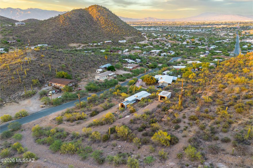 This lot at 2445 Irvington Place in Tucson offers a remarkable canvas for your dream build. Zoned SH with water, electric, and gas utilities already available on-site, the groundwork is set for seamless construction. Take in stunning city views that shimmer after sunset and distant mountain vistas that frame the desert horizon. A new community park is taking shape nearby, while Kennedy Park and Target Grocery along Irvington Road provide everyday convenience just minutes away. The Mission/Ajo bus station keeps you connected throughout Tucson. Real potential awaits in this up-and-coming neighborhood.