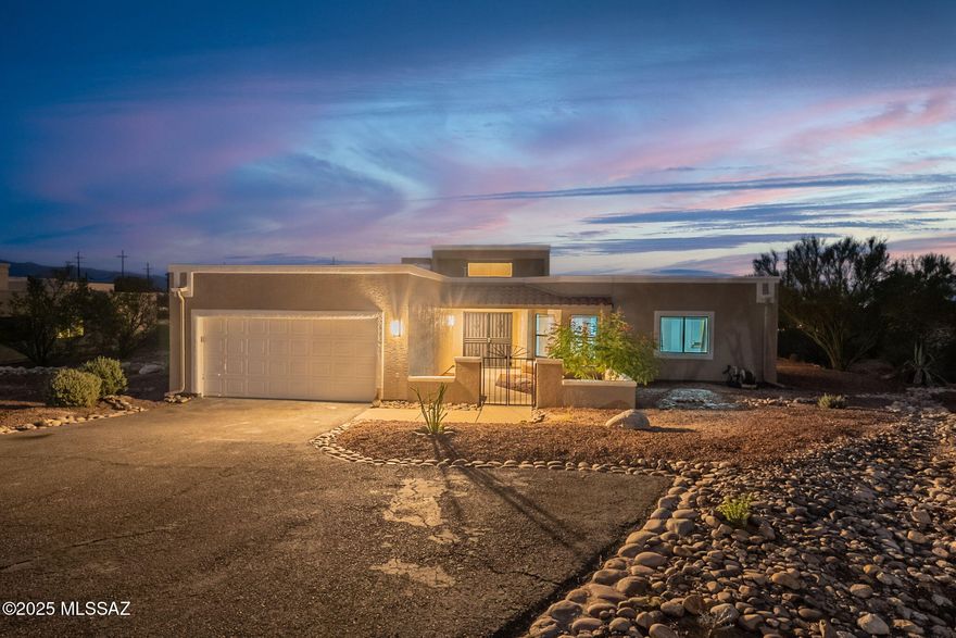 Welcome to this beautifully refreshed Foothills home in a prime Tucson location! Move-in ready and full of upgrades, this single-story gem sits on nearly 0.88 acres and blends charm, quality finishes, and comfort. Inside, enjoy fresh neutral paint, new bedroom ceiling fans, and a fully renovated kitchen with granite countertops, under-mount sink, upgraded faucet, and backsplash. The unique flagstone floors are cleaned, sealed, and gleaming. Spacious vaulted living areas offer great natural light, two full baths, and generous storage. Outside features fresh paint, mountain and city views, a covered patio, low-maintenance desert landscaping, and a 2-car garage. Tranquil yet close to shopping, dining, and main roads.
