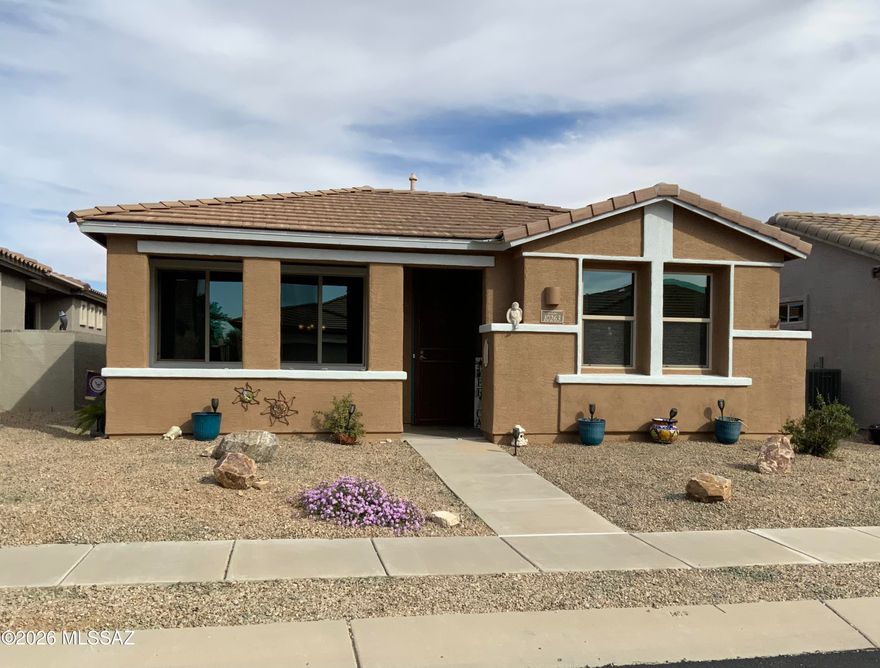 Charming home w/fully owned Solar in Del Webb at Rancho del Lago - an established active adult (55+) community located in the heart of Vail, AZ. Inviting front porch, Living Rm, 2 Bedrooms + Den, 2 full baths, tall ceilings and tiled floors. Extended kitchen cabinets, granite counters, refrigerator, gas range, newer MW & DW, XL deep sink, rollouts. Tankless H/W. Laundry Rm, washer & dryer. Courtyard patio off kitchen with 2 gates. Garage has overhead storage. Rear garage entry from White Surrey Dr. 

Enjoy community amentiies and activities including: Swimming, spa, fitness, pickleball, tennis, bocce, classes, walking paths, and more! Del Webb is adjacent to Del Lago golf, close to grocery & conveniences. You can't miss the nearby Rincon Mountains...they always put on a show!