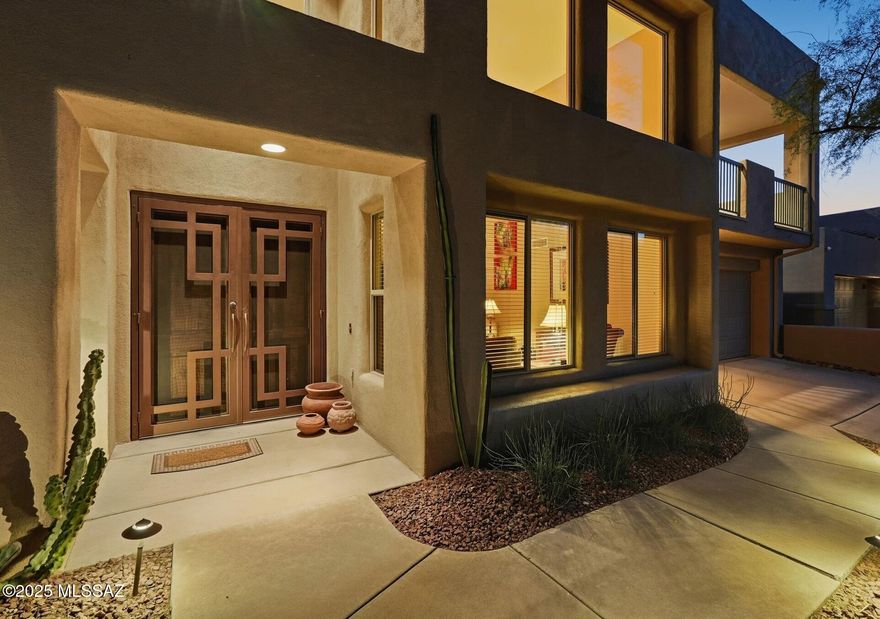 Stunning Foothills Retreat with Panoramic City & Mountain Views nestled within the gated enclave of Bonita Ridge. This
 beautifully maintained 4-bedroom, 3-bath residence offers a rare blend of privacy, elegance, and breathtaking desert scenery. Perched to capture sweeping city and mountain views, the home showcases unforgettable sunsets and sparkling city lights from its serene backyard oasis.
The light-filled interior features expansive windows that flood the home with natural light, creating a warm and inviting ambiance throughout. The tastefully updated kitchen features generous cabinetry, ample counter space, a dedicated prep area, and a breakfast bar--perfect for both everyday living and entertaining. A main-level guest bedroom and full bath provide ideal flexibility for visitors o multigenerational living. Upstairs, the spacious owner's suite is a true retreat, complete with a private balcony overlooking the valley below. Two additional bedrooms complete the upper level, including one with a Jack-and-Jill bath and another with its own private balcony. Located just minutes from trailheads, shopping, restaurants, and the natural beauty of Sabino Canyon Recreation Area. This home offers the perfect balance of convenience and tranquility.  Enjoy community luxuries including landscaped paths, a large pool, spa, and secure gated entrance. Welcome Home!
