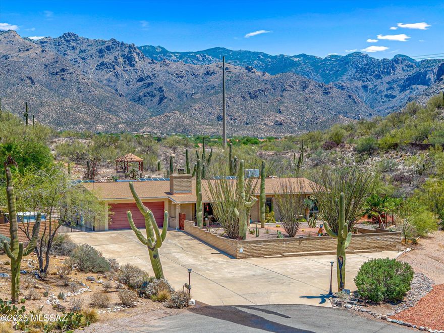 Welcome to your tranquil, Catalina Foothills oasis. As you enter the home on your elevated lot, you will be greeted by exquisite Southwest touches throughout. Take note of the recently updated kitchen with quartz countertops, updated backsplash and appliances, refreshed cabinets, along with the remodeled laundry room.

As you exit to your backyard, you will see what makes this property so special - A lot that is over 0.6 acres abutting onto nature and jaw dropping Santa Catalina mountain views. Your backyard offers mature desert landscaping, including majestic saguaros ocotillos and a dedicated green house. 

Take a walk up to your private gazebo for even more spectacular views. The home also has a rainwater catchment system which connects to the water irrigation system. The home's location at the end of a cul de sac provides an elevated level of peace and quiet to enjoy your outdoor space. 

RV parking is available, and the solar system is owned. Come see what makes this rare find so special, and make it yours.