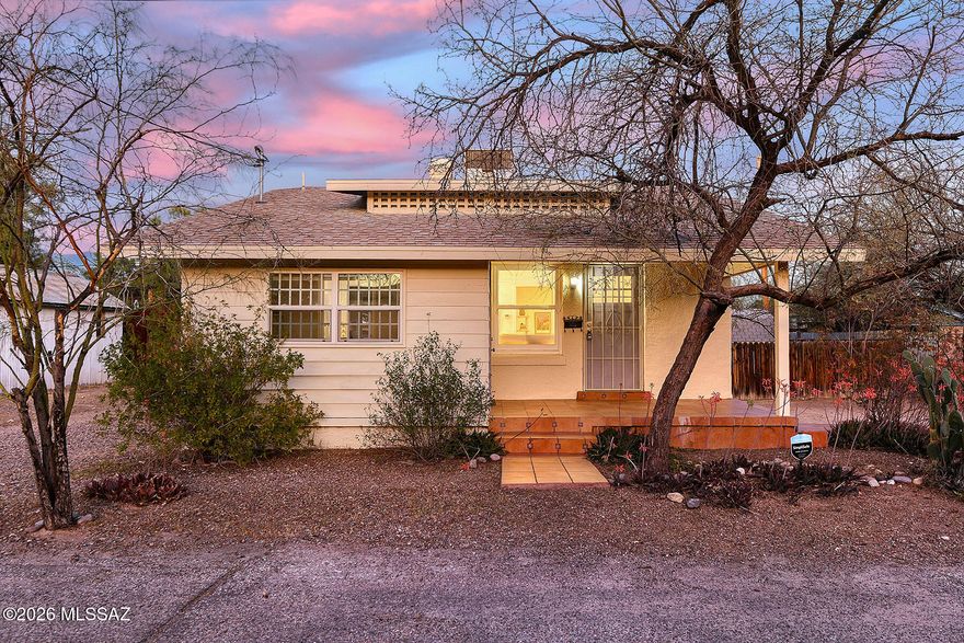 Rich in historic charm, this vintage 1920 bungalow features warm and welcoming living areas, making it a wonderful place to call home or an excellent rental property.  In the heart of the desirable West University neighborhood, it is ideally located near Tucson High School, the University of Arizona, the shops along 4th Avenue, downtown Tucson, and Time Market on University Boulevard. With 984 sq. ft., three bedrooms, two bathrooms, and a large unfinished basement, this charming home has benefited from numerous upgrades and improvements over the years.  In 2012, the property underwent extensive renovations including installation of a new gas-fired central air conditioning system (recently serviced in March 2026), a new asphalt shingle roof, and all-new plumbing from the street to the home, including both waste and water supply lines. Electrical improvements included updated electrical service and additional outlets. Beautiful Italian ceramic tile was installed on the front and back porches and along the south-side walkway.  Additional recent improvements include a new refrigerator, basement upgrades with new retaining walls and support beams, new electrical wiring throughout the home, a new water heater installed within the past two years, a Talavera tile kitchen countertop, and a new vanity in the first bathroom. The original wood floors have been refinished throughout, and a new gas line has been installed to serve all gas appliances.  This wonderfully charming home truly must be seen to be appreciated. As one experienced Realtor thought recently while sitting in the living room "I could live in this darling home!"