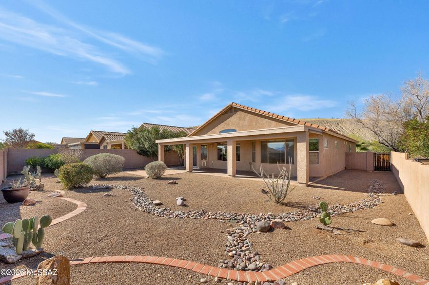This is one you need to see in person! This elevated lot hides the neighbors below while allowing the views of the Santa Rita Mountains to steal the show! Spacious, fully landscaped, low care backyard with full length patio to enjoy our amazing weather & views. Step inside to this efficiently designed great room floorplan. The kitchen opens to the living and dining area with views out to the backyard. New carpet in the bedrooms and den, tile throughout the rest of the house. Located at the north end of Green Valley, you aren't far from Tucson but still within the Green Valley Rec area to enjoy all the 55+ amenities, like classes, pools, pickleball & tennis and a club for just about all of your favorite hobbies! Visit gvrec.org to learn more about all the community has to offer!