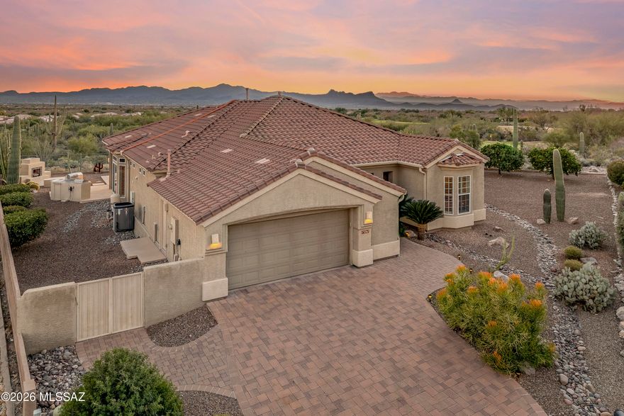 Truly a one of a kind JEWEL located in the gated Highlands at Dove Mountain. PRIVACY AND VIEWS are WOW WOW..... 180+ degree views of 5 mountain ranges, city lights, high Sonoran desert with abundance of saguaros, golf & so much more! Backyard entertaining areas include a pebble tec pool,  outdoor fireplace, outdoor kitchen w/new gas BBQ, electronic sun screens, built in gas heaters on patio, extensive decking and much more. This home is loaded with upgrades including a  custom kitchen island bar with slab granite countertop, built in hutch in great room, built in desk & book shelves in den-office, wood floors in great room & master suite, newly painted interior and exterior, paver driveway, walkways and so much more!  All furnishings are included.See documents for features & benefits list