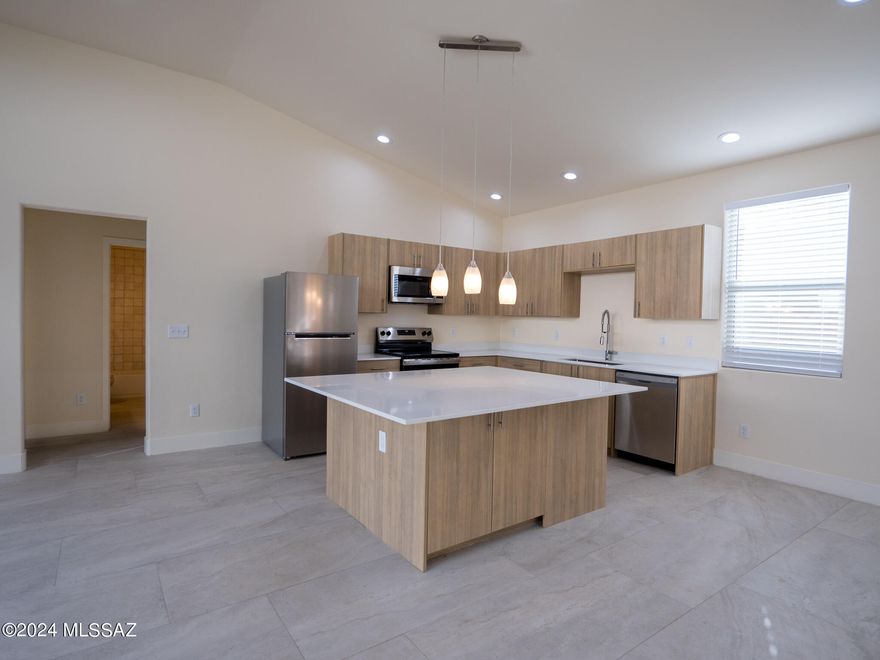 *AVAILABLE FOR JUNE MOVE IN* Text for a Walkthrough Video/more info. 2024 Construction w/ Premium Finishes abound in this 3 Bedroom/2 Bathroom 1429sf Duplex Unit located in Central Tucson near Shopping, Restaurants, Banner Medical Center, University of Arizona, and Downtown. The open and airy interior features include; Entertainer's Kitchen w/ oversized Island, Solid Surface counters, Stainless Appliances, Contemporary Cabinetry; Master Suite w/ Dual Vanities, tiled Shower, Walk-in Closet; oversized Ceramic Tile throughout Unit; Window Wall w/ access to the private yard; Central A/C; and Washer + Dryer included. 12mo minimum Lease, Costs are: Non-refundable $50/adult Application, $2050 Security Deposit, $150/pet with approved pet, $400 cleaning. Tenants pay electric only.