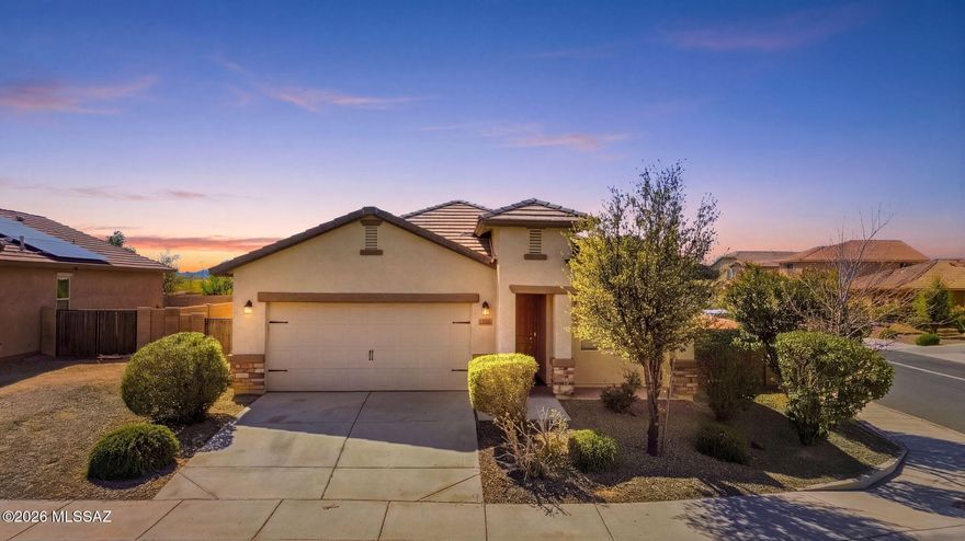 Tucked on a spacious corner lot in the desirable San Lucas community, this thoughtfully designed Bisbee floor plan blends comfort and style. The kitchen features granite countertops, custom dark wood cabinetry, brushed nickel hardware, and energy-efficient stainless steel appliances. A separate dining room creates the perfect space for gatherings, while the covered patio invites relaxed outdoor living. The private primary suite includes a walk-in closet for added convenience. Additional highlights include an attached two-car garage and front yard landscaping. Residents enjoy community amenities such as a park with basketball courts, sand volleyball, and a baseball field.