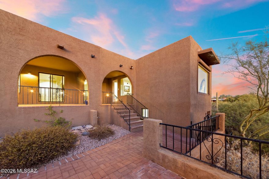 Experience elevated Foothills lliving where sweeping mtn vistas & sparkling city lights create a stunning backdrop from private cul-de-sac setting. Thoughtfully updated featuring expansive windows that frame the surrounding landscape & fill the interior w/natural light. Remodeled kitchen designed for both style & function offering upgraded cabinetry, striking waterfall island & SS appliances. Generous living spaces provide inviting spaces for entertaining or relaxing while enjoying the views. Peaceful primary retreat w/panoramic windows & spa-inspired bath w/dual vanities & waterfall shower. Four add'l rooms offer versatile space for guests, a office, fitness rm or studio. Extended covered rear patio stretches along the home overlooking the natural desert terrain & breathtaking city views! Near La Encantada for upscale shopping, dining & entertainment--perfect Foothills lifestyle! Full renovation in 2018 followed by an additional 50k in upgrades by current owner, including carbon-activated whole house water softener with reverse osmosis for kitchen and refrigerator; new oven and dishwasher; plantation shutters in the living room and master bath. The crown jewel is an owned-not-leased commercial-quality solar array that wipes out your energy costs and fuels your electric car.