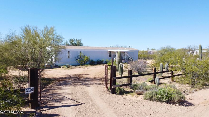 This 3 bedroom 2 bathroom home sits on 1 acre of land with no HOA! All utilities are available and connected to the home. Horses are allowed. It features a 2 car carport and storage shed on the lot. The interior features vinyl flooring, quartz counter tops, stainless steel stove and microwave, under mount kitchen sink, newer shaker style cabinetry, newer lighting fixtures, fans ceiling fans throughout, lots of natural light throughout, the master features a walk in closet, full tub, newer double vanity, framed mirrors, with modern vanity lighting, the guest bathroom features a modern vanity, framed mirror, and modern light fixture. The home has a newer HVAC unit and covered patios on front and back porch. Seller willing to finance-no bank needed. Please call for info.