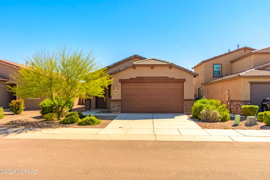Like-new and beautifully designed, this 4-bedroom, 2-bath contemporary home in the highly sought-after Gladden Farms community offers the perfect blend of comfort, style, and functionality.
Step inside to a thoughtfully crafted split-bedroom floor plan that creates both privacy and flow. The heart of the home features an open-concept kitchen and great room--ideal for entertaining, gathering, and everyday living. Natural light fills the space, creating a warm and inviting atmosphere from the moment you walk in.
The front wing of the home offers three well-sized bedrooms and a spacious hall bath with dual sinks--perfect for family, guests, or a home office setup. Tucked away in the back for added privacy, the primary suite serves as a true retreat, complete with a dual-sink vanity, walk-in closet, private toilet area, and a separate shower designed for relaxation.
Step outside to a low-maintenance backyard with room to enjoy Arizona living year-round.
Whether you're hosting, unwinding, or simply enjoying the comfort of home, this property delivers a seamless balance of modern living and everyday convenience--all in a vibrant, desirable community.

Welcome home.
