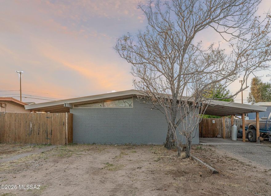 **Seller will give $5,000 credit towards new appliances!** This 2-bed, 1-bath home with a metal roof and central AC backs to the desert for privacy and sunset views! This property has been completely remodeled inside, with new flooring, new interior/exterior paint, new kitchen cabinets, and remodeled bathroom with new tile shower and vanity. Newly installed water heater, and recently installed air conditioning. The large backyard is fully-fenced, with a gate for alley access and no neighbors behind! Red car in front yard and boat/trailer in backyard will be removed prior to closing. No HOA!