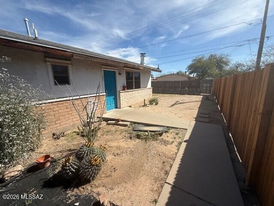 This pet friendly, 2 bedroom, 1 bath duplex is set in the back offering you peaceful privacy. The fenced yard is large enough to kick back and relax or have a barbecue while allowing room for kids and pets to play. The interior has been recently remodeled. There is an eat-in kitchen with plenty of storage and a living room with a fireplace. A carport for one car also has a storage room with W&D hookups. A new furnace and AC will give you low cost, worry free comfort.