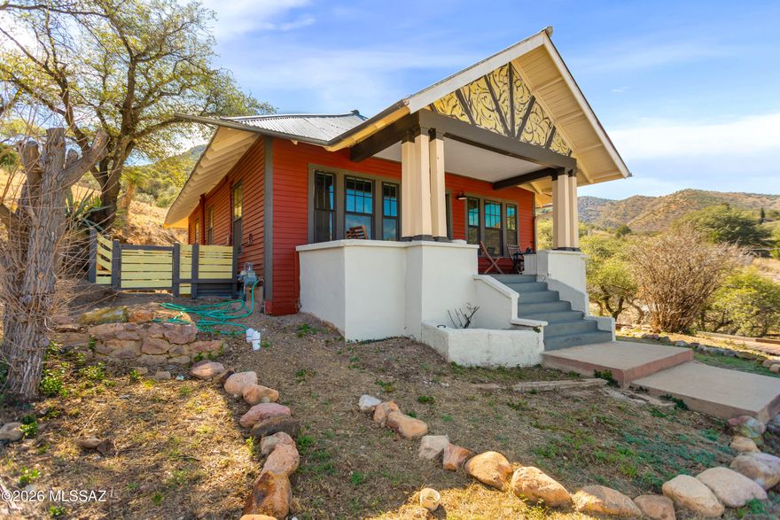 Welcome to 816 C Tombstone Canyon, a stunning hillside retreat with captivating curb appeal and sweeping views from the cozy front porch. Nestled on a 0.115-acre lot in the heart of Bisbee, AZ, this home is just steps away from the Gallery 818 Artemizia Foundation Museum and nearby playground, offering both cultural enrichment and outdoor enjoyment right at your doorstep. Bisbee, known for its vibrant arts scene, historic charm, and picturesque streets, provides the perfect backdrop for this unique home.
The spacious interior, offering approximately 1675 sq ft (this does not include the 385 sq ft basement) of living space (owner's estimate, public records indicate 1,288 sq ft), has been thoughtfully renovated and fully upgraded. Every surface, utility, and system has been replaced, MORE including new sewer lines, water, and  electrical all up to code for peace of mind. The living area is an inviting blend of aesthetics and efficiency, with Mini-split systems providing both heat and air conditioning throughout the home, ensuring comfort in any season.
The kitchen is a chef's dream with a gas range, a large walk-in pantry, and a modernized design featuring industrial wire baskets in place of traditional cabinets. The reclaimed birch flooring adds a rustic touch, while the adjacent living and dining areas are graced with original maple flooring, exuding timeless charm. The front bedroom boasts the warmth of original Douglas fir flooring.
A wood-burning stove with an oversized hearth adds a cozy, rustic feel to the living space. Reclaimed barn doors offer an artistic touch, serving as partitions between the living and front bedroom, as well as for the bath and closet areas in the main bedroom. The bathroom features oversized subway tiles, custom lighting above the sink, and more reclaimed birch flooring, enhancing the home's natural aesthetic.
All windows have been replaced with Jeld-Wen double-pane windows, still under warranty for added value. The upstairs loft (bedroom) includes a huge walk-in closet perfect for extra storage or as a creative space to make your own. The unfinished basement offers ample potential, with overhead lighting and limitless possibilities for woodworking, hobbies, or even transforming it into your private retreat.
This home is fully insulated from neighboring properties, ensuring ultimate privacy. Parking is abundant, with spots located behind and on the side of the house. A custom pet fence encloses the south portion of the yard, providing your pets with a safe space to roam freely. No flood zone gives you peace of mind, and the hillside lot offers elevated views and tranquility.
The driveway area does not convey but is a bonus benefit landlock laws prohibit others from using it, meaning you enjoy privacy, as well as reduced taxes.
All appliances convey with the sale, and the owner is offering a year-long home warranty for added assurance.
Bisbee, AZ, with its eclectic mix of art galleries, historic sites, and vibrant downtown, offers a rich cultural experience for residents and visitors alike. From the fascinating copper mine tour to strolling through the quaint shops and enjoying a variety of restaurants and boutiques, this lively town has something for everyone. Whether you're exploring the arts at the Gallery 818, relaxing in the local playground and city parks, or indulging in Bisbee's unique shopping and dining scene, you'll be part of a thriving and welcoming community.