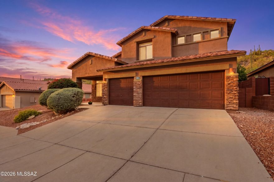 Beautifully UPDATED 2,904 sq ft Catalina Foothills home backing to natural desert with low-maintenance outdoor living and added privacy. This stunning 4-bedroom, 3-bath residence offers a spacious and functional layout with the primary suite conveniently located downstairs. Soaring ceilings, architectural details, and abundant natural light create an inviting atmosphere throughout. Recent upgrades include new ceramic tile flooring, fully updated kitchen and bathroom cabinetry, and a refreshed laundry room, blending modern style with timeless comfort.
The redesigned kitchen features granite countertops, a large island with crown molding, newer stainless-steel appliances, and ample storage. Ask  about lender paid 1 year rate buy down! Owner/Agent Additional highlights include bay windows, plantation shutters, and a spacious upstairs entertainment area perfect for relaxing or hosting guests.
The 3-car garage offers custom cabinetry and generous storage space. Thoughtful upgrades continue throughout the home with wiring for surround sound and security, plus extra buffer space between neighboring lots for added privacy. Located in a desirable gated Catalina Foothills community with access to community amenities and close proximity to shopping, dining, and outdoor recreation.