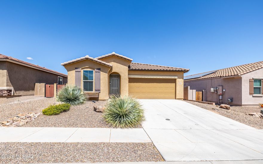 Beautiful house-check, great location-check, the ability to transform it into your dream home-check!  Come view this 4 bed/2 bath home & investigate the sensation of living the Rancho Sahuarita lifestyle. Upon entering, you're greeted by lots of natural light and you'll notice the open floor plan flows seamlessly from kitchen to living room making it perfect for large gatherings. The low maintenance landscaping in both the front & back yards was thoughtfully designed so you can spend less time on upkeep and more time enjoying everything the neighborhood has to offer.  Included in the HOA dues are access to the lake - perfect for strolling after dinner, the water park - great for the small ones, the Clubhouse and fitness centers - so you can stay fit & so much more!