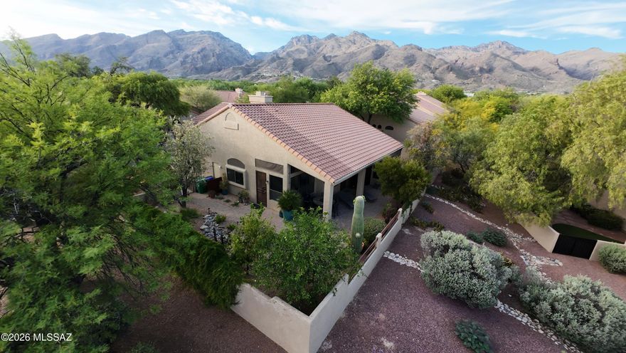 This beautiful, Vista Plan 3 fully remodeled, single-story detached villa in the guard-gated Ventana Canyon Golf & Racquet Club community in the Catalina Foothills of Tucson won't last long!  Spacious 2,204 sq ft of true single-level living on a private south-facing corner lot with no shared walls. No interior steps, vaulted ceilings, luxury tile and lovely gas fireplace.  Spacious 3rd bedroom/office. Newer dual-paned windows, black quartz countertops, glass-top induction cooking and SS appliances. This home boasts a brand-new roof, refreshed landscaping w/water feature and custom lighting, and  Rachio irrigation system for year-round control.  Plentiful pomegranate, orange and lemon trees and covered patio make the yard a true oasis and great for entertaining with majestic mountain views!