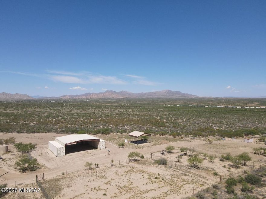 Scenic Dragoon 36.38 acres on Paved Dragoon Road. Nestled in the valley between the Dragoon and Little Dragoon Mountains, offering Panoramic views of the mountains and  inspiring sunrises/ sunsets.  This prime mini-ranch has large 40x40  barn, covered RV parking, corrals, pasture fenced in welded wire fencing., 8 acres enclosure securely fenced for dogs !  Private, deep well with storage tank.  Electric and RV septic on-site.  Property is ready for your new home ! Fronts on Dragoon Road and north boundary is Dragon Winds Road offering ease of access.  Only 1/4 mile to National Forest for miles of riding and hiking!