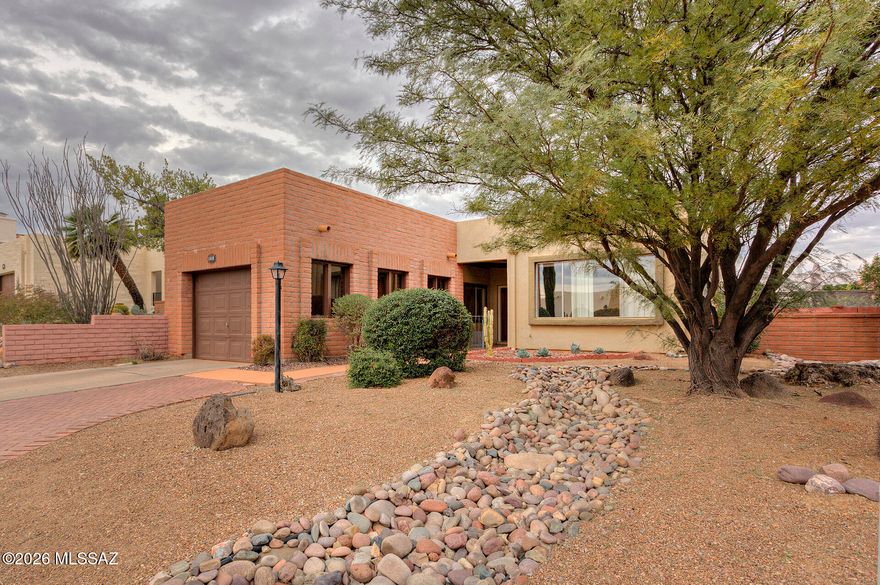 This Desert Hills townhome features two bedrooms, 2 full baths and a lovely bonus Arizona room perfect for hobbies or entertaining. The back yard is a paradise with native plants, fruit trees, a covered patio and so peaceful. The kitchen has lots of storage and quartz counters. The attached garage is light and bright and has more storage. Don't let this one slip away. Enjoy your navel orange, mandarin orange, and lemon trees