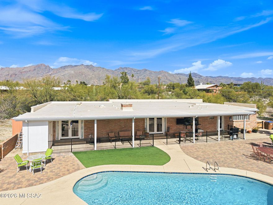 Enjoy elegant foothills living, twinkling city lights and mountain views! A large front covered patio welcomes you into the entry, living room and formal dining area. Comfortable family room with a beehive fireplace and a modern, bright, and open kitchen featuring a breakfast bar and sweeping views of the pool and rear yard. The generous primary bedroom and bath, an additional en suite with patio and pool access, and 2 additional bedrooms all feature ceiling fans. Spectacular outdoor living in a resort sized rear yard and pool area including a full length covered patio! Perfect for family gatherings and special events! Relax in this quiet setting, just minutes from restaurants and shopping!