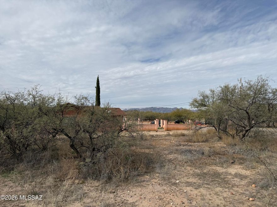 Discover the possibilities at 165 Paseo Dulzura #32 in Rio Rico, AZ. This spacious vacant lot offers paved road access and utilities available at the lot line. Enjoy sweeping views in every direction, with stunning mountain backdrops and colorful Arizona sunsets that showcase the beauty of the high desert. Tucked in a peaceful setting yet conveniently located near local amenities, shopping, dining, and quick access to I-19 for an easy commute to Tucson. Whether you're ready to build your dream home now or invest for the future, this lot offers space, scenery, and opportunity in Southern Arizona.